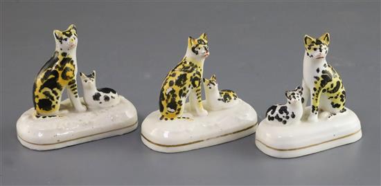 Three Staffordshire porcelain groups of a cat and kitten, c.1830-50, H. 6.7cm - 7cm